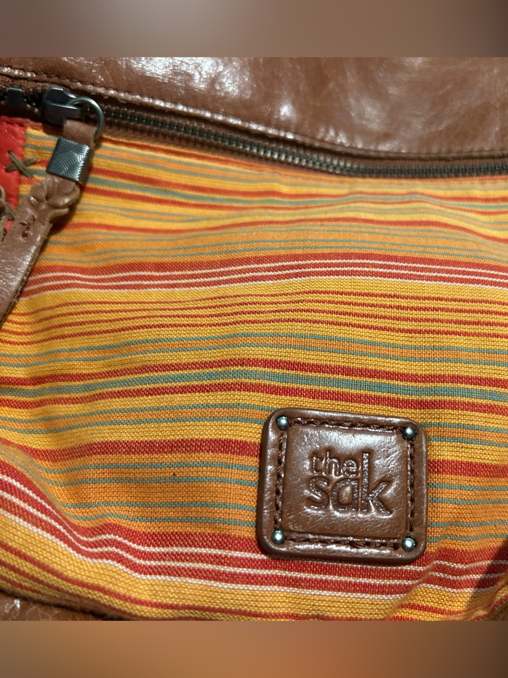 The Sak Brown Leather Drawstring Shoulder Bag with Orange Accents - Picture 2 of 9